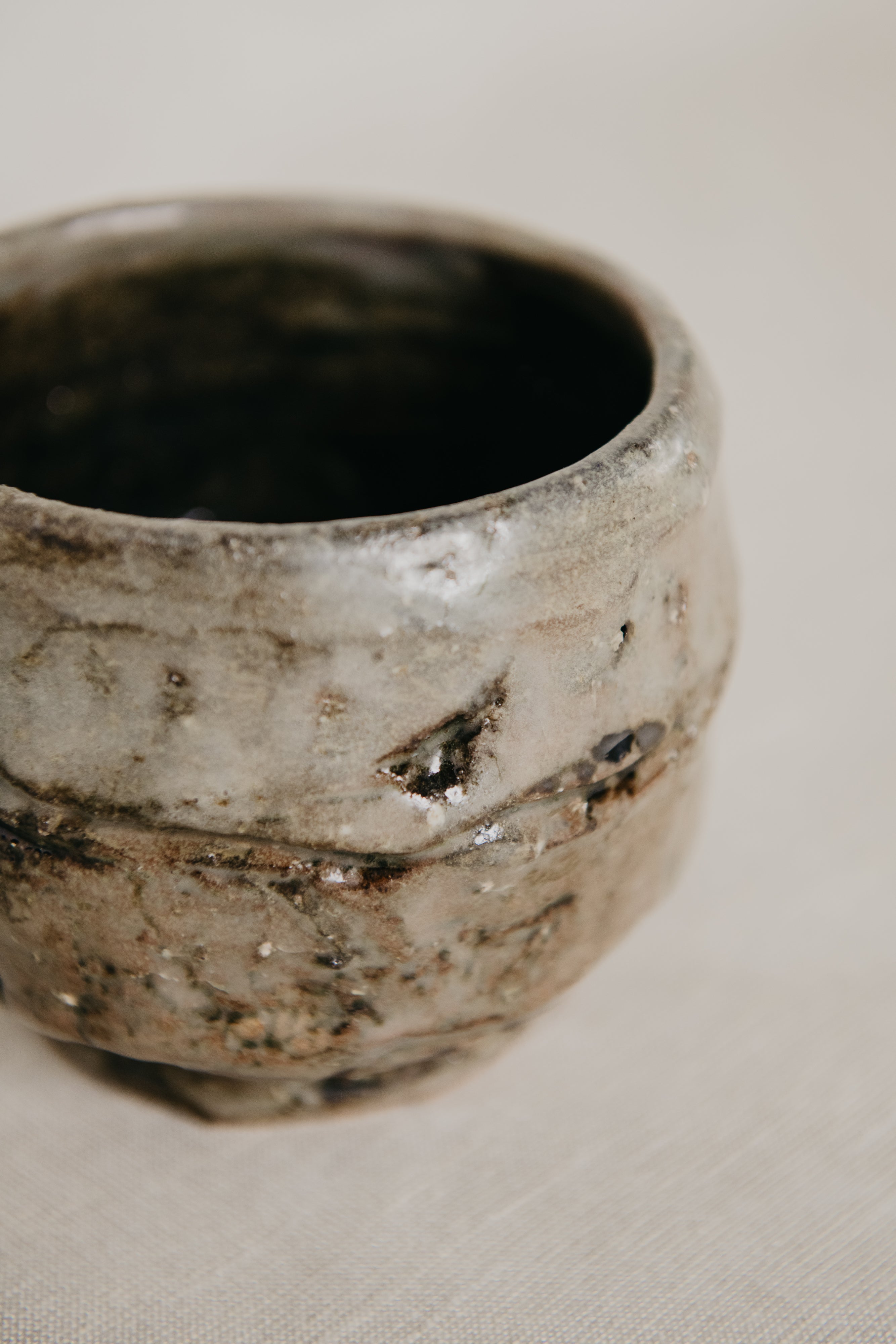 Ceramic bowl with textured surface on a neutral background