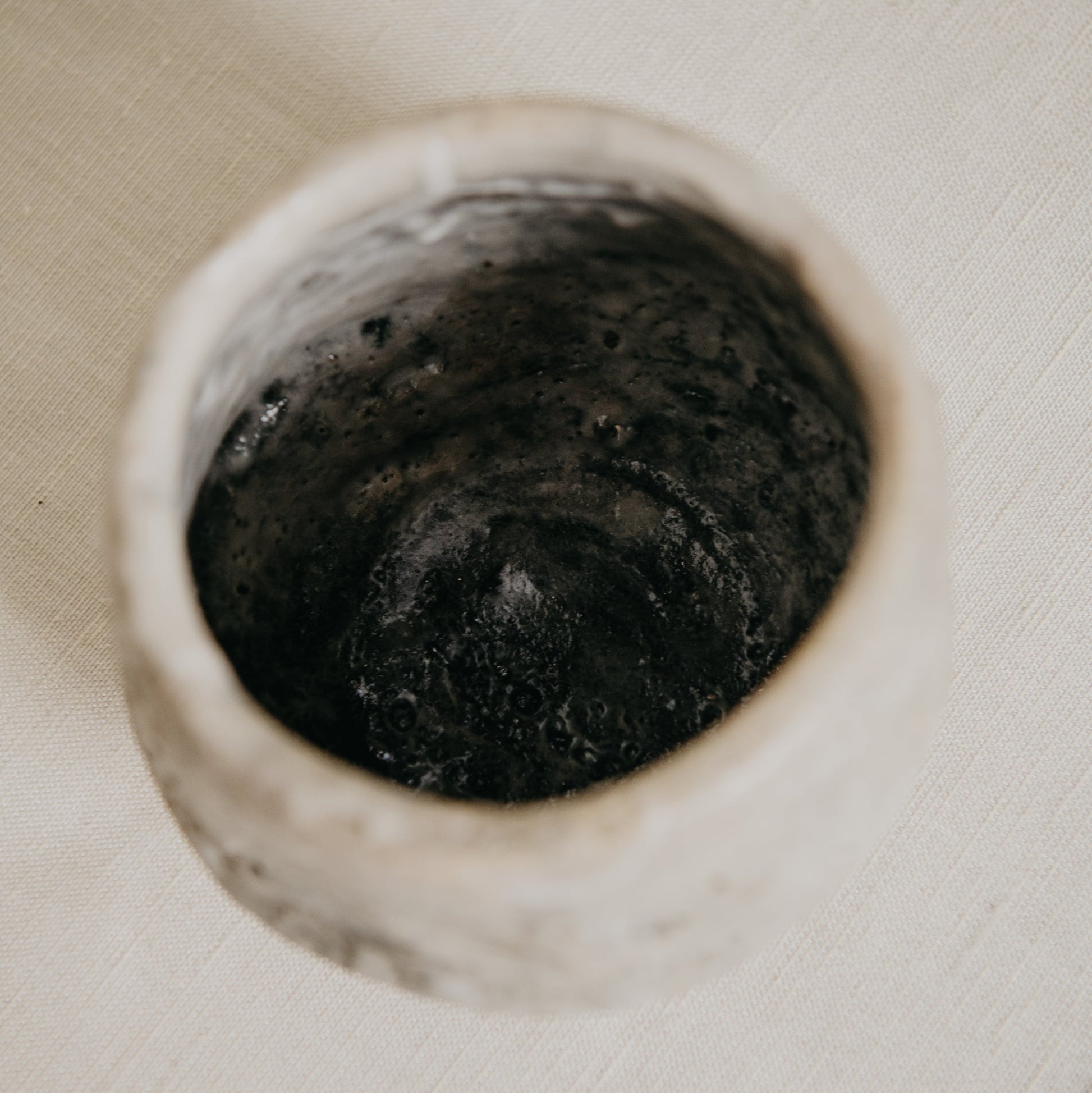 Close-up of a drain in a bathroom sink