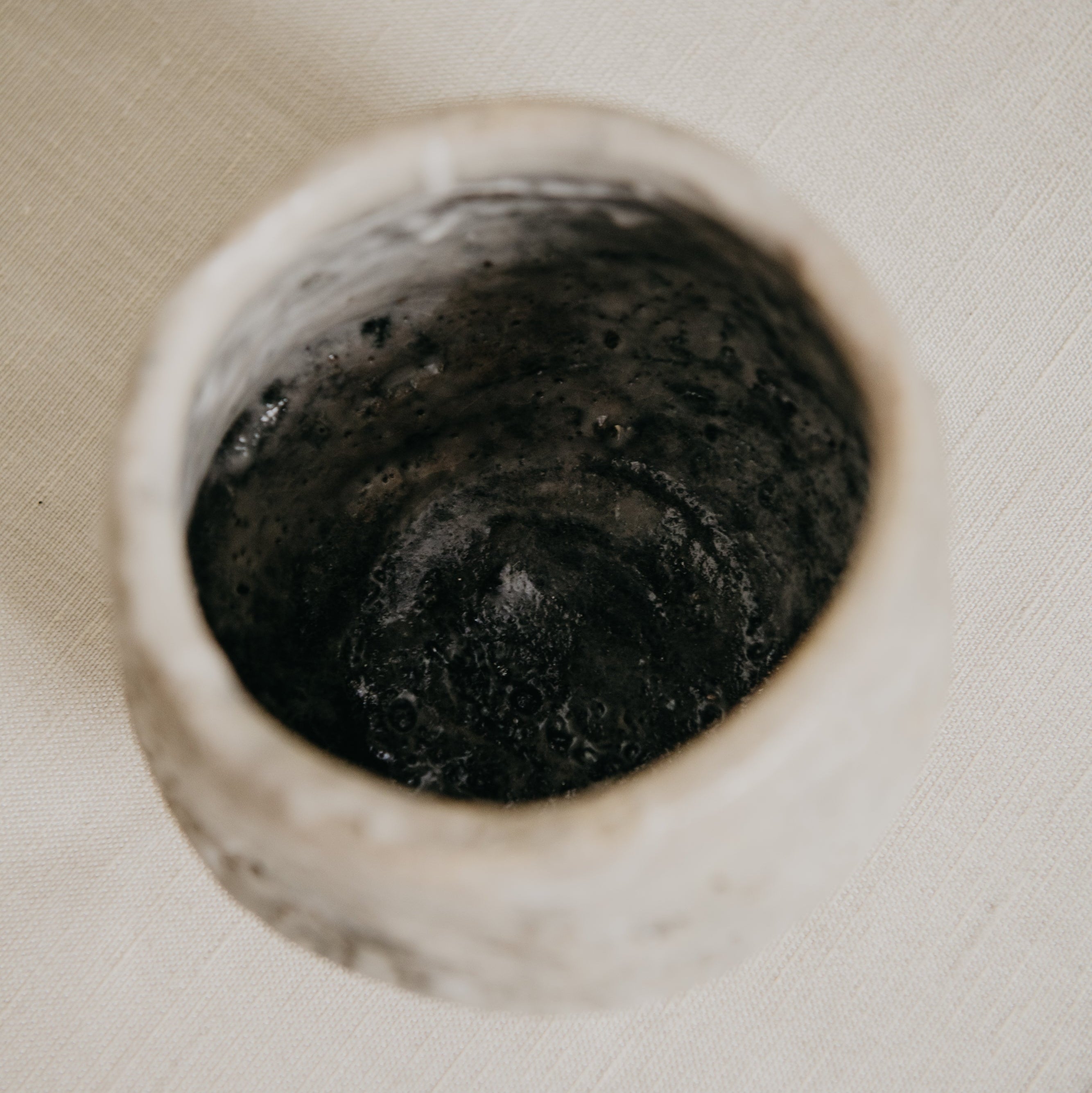 Close-up of a drain in a bathroom sink