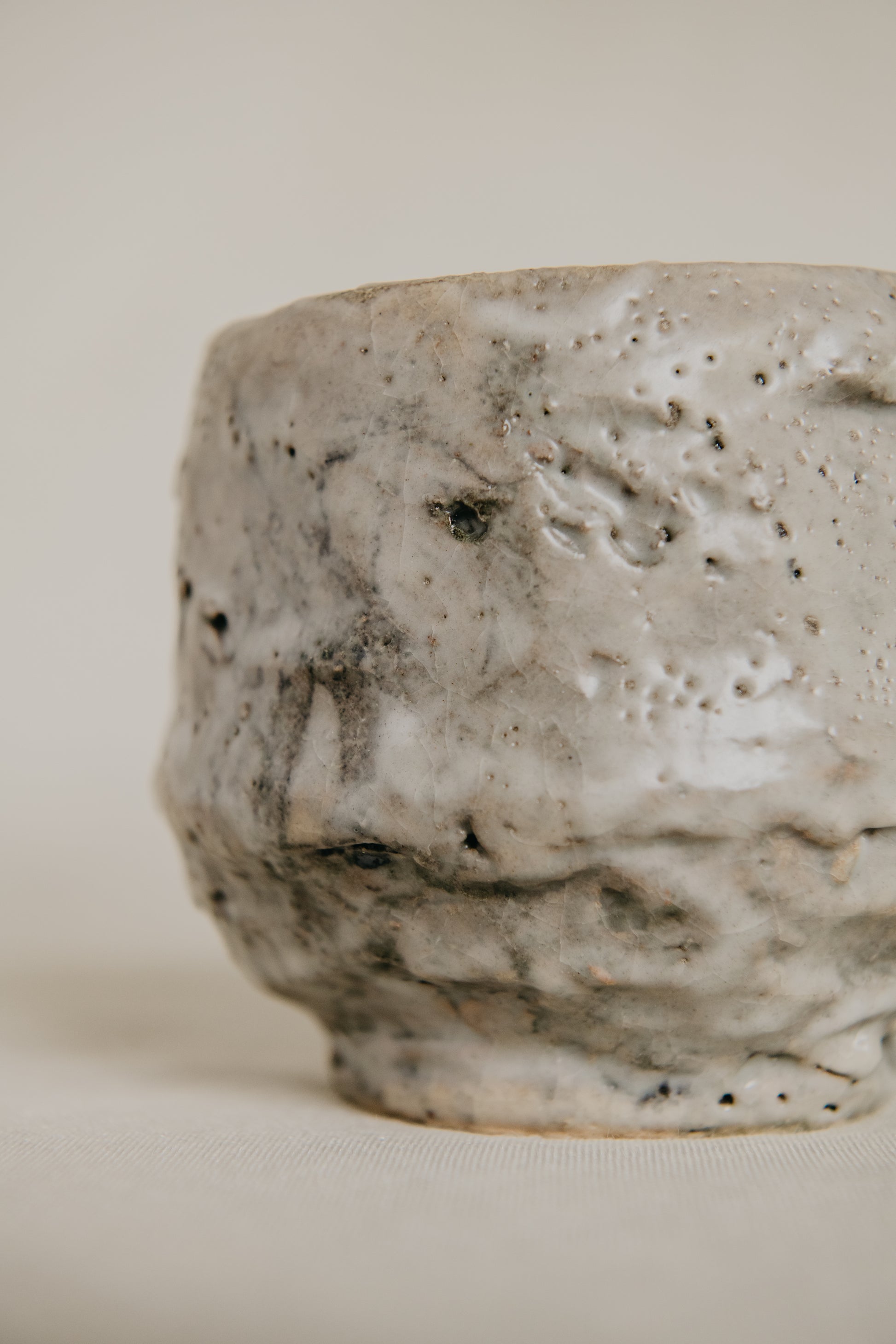 Textured ceramic bowl on a plain background