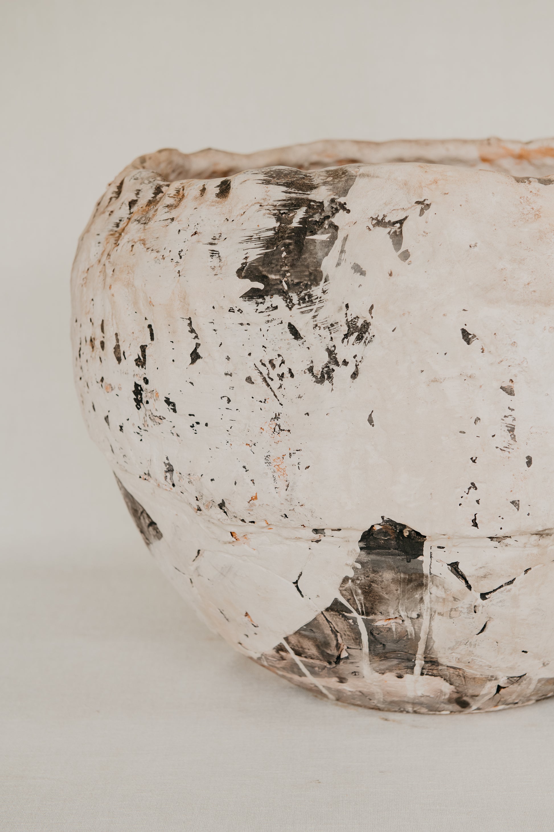 Decorative ceramic bowl with a textured surface on a light background