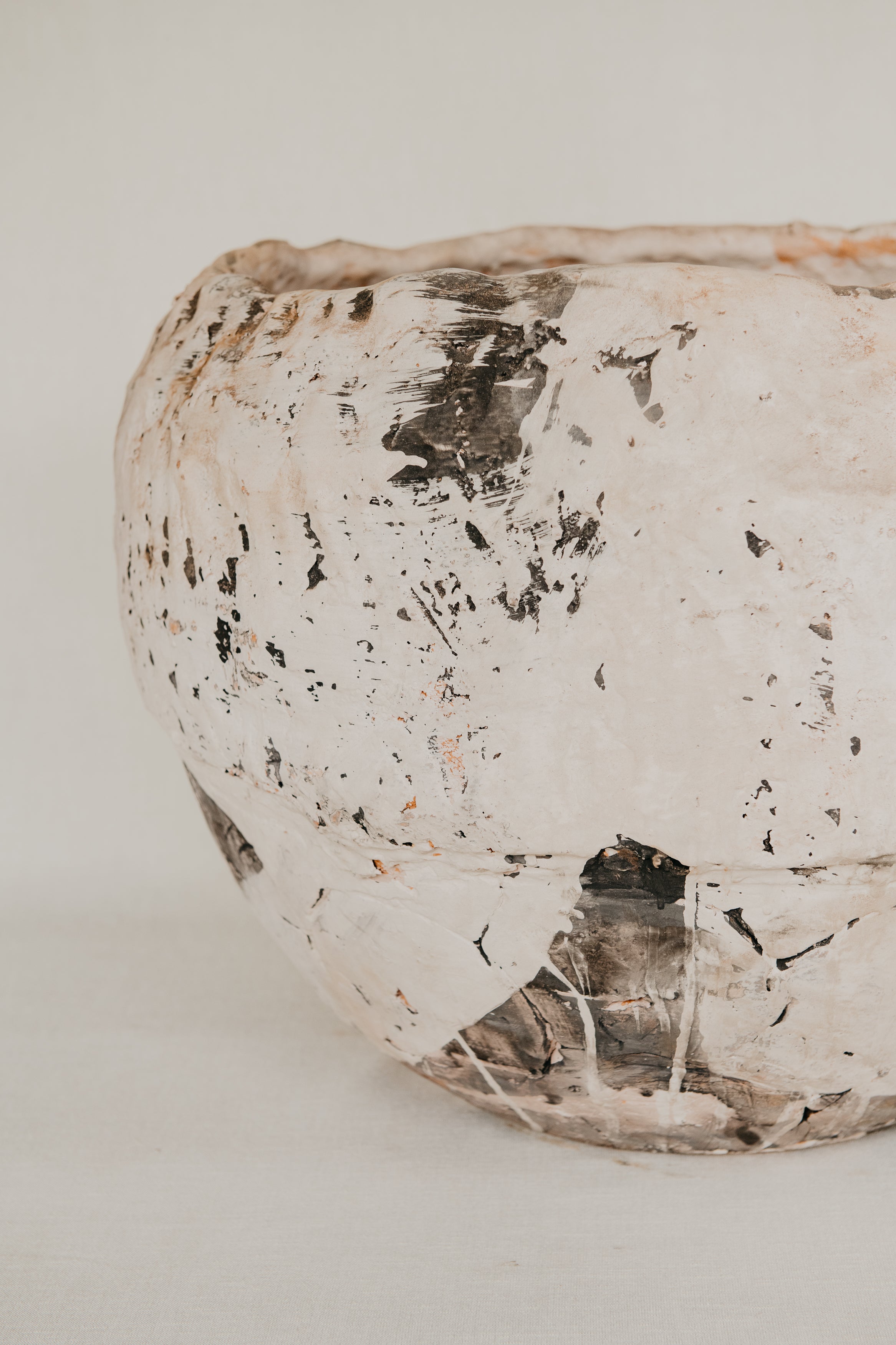 Decorative ceramic bowl with a textured surface on a light background
