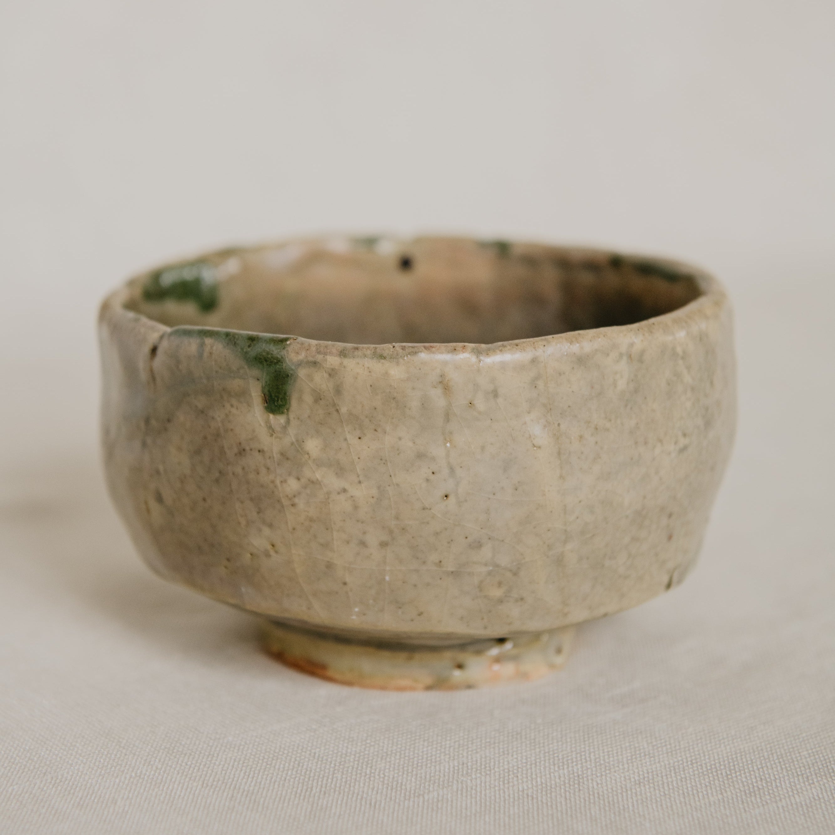 Small ceramic bowl with a textured surface on a plain background