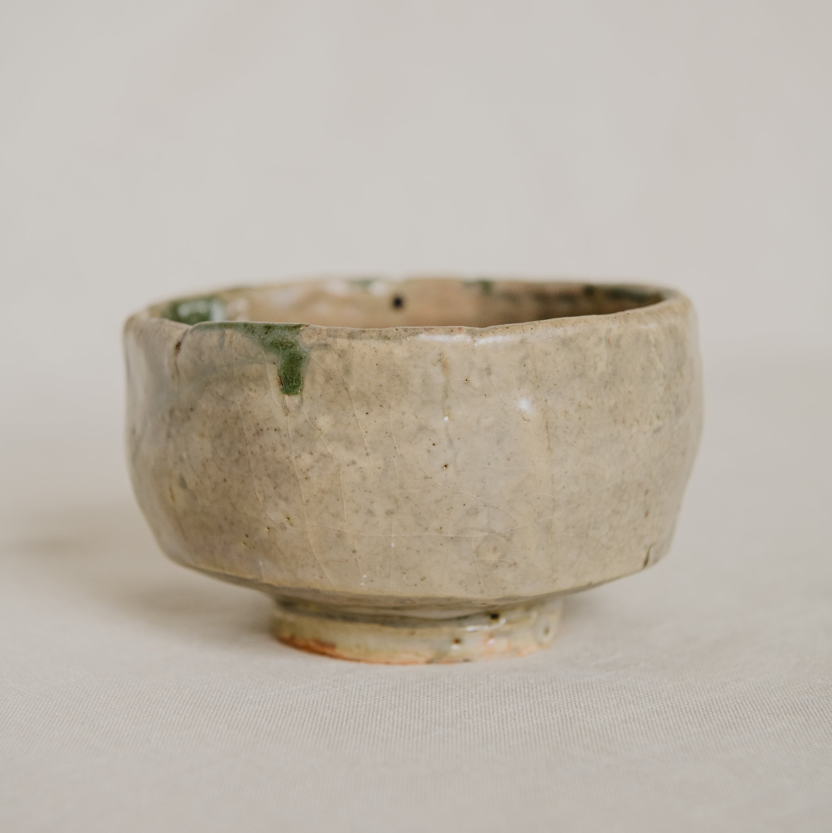 Ceramic bowl with a textured surface on a plain background