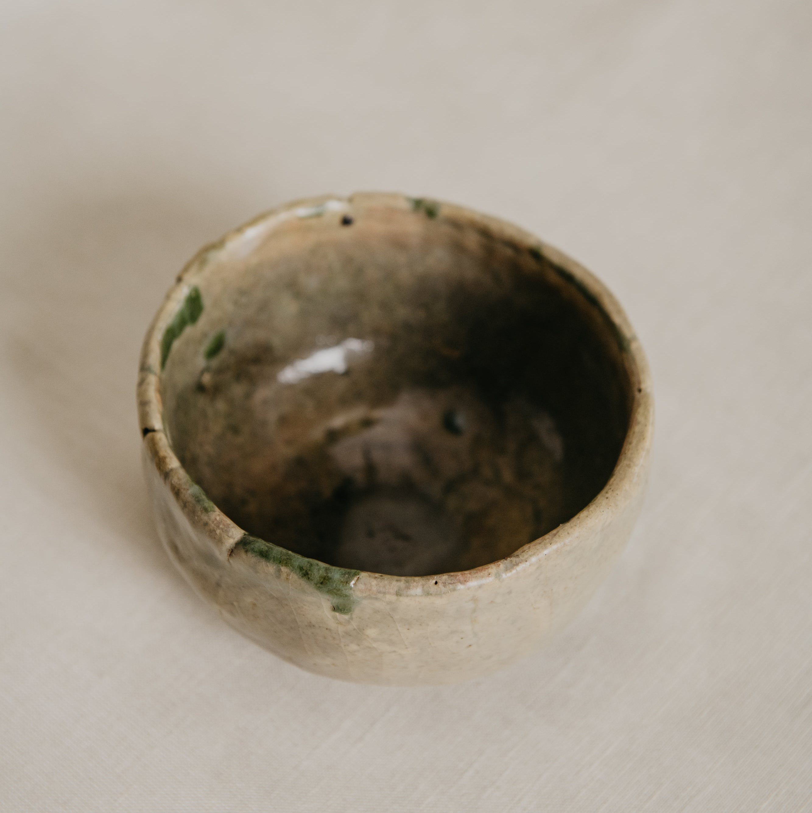 Ceramic bowl with a textured surface on a light background